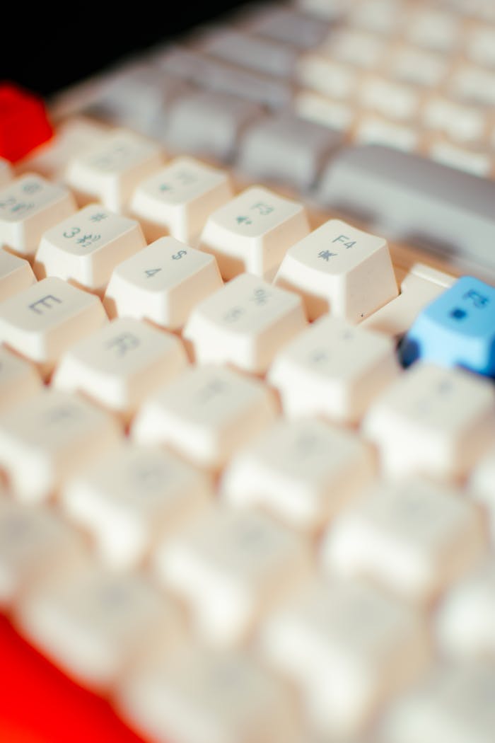 Detailed shot of a mechanical keyboard featuring Asian character keycaps, emphasizing tech elements.
